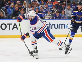 Adam Henrique (19) of the Edmonton Oilers shoots the puck against the St. Louis Blues at Enterprise Center on April 1, 2024, in St Louis, Ms.