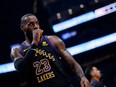 LeBron James walks the court during a break in play against the Toronto Raptors in the first half at Scotiabank Arena on April 2, 2024.