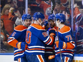 Cody Ceci (5), Corey Perry (90), Evander Kane (91) and Ryan McLeod (71) of the Edmonton Oilers celebrate Kane's goal against the Colorado Avalanche at Rogers Place on April 5, 2024, in Edmonton.