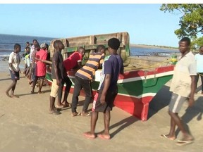 This video grab obtained by AFPTV from TVM on April 8, 2024 shows the boat, that sunk off the north coast of Mozambique killing 96 people, on the Island of Mozambique. A makeshift ferry boat has v, including children, authorities said on April 8, 2024, raising an earlier death toll. The converted fishing boat, carrying about 130 people, ran into trouble late on April 7, 2024 as it was trying to reach an island off Nampula province, officials said. Most of those on board were trying to escape the mainland because of a panic caused by disinformation about cholera, according to Nampula's secretary of state Jaime Neto.