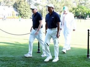 Tiger Woods leaves the course to enter the Clubhouse after practicing a few holes with Rob McNamara and caddie Lance Bennett prior to the 2024 Masters Tournament at Augusta National Golf Club on April 07, 2024 in Augusta, Georgia.
