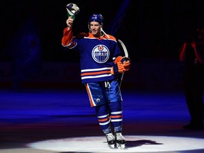 EDMONTON, CANADA - APRIL 10: Dylan Holloway #55 of the Edmonton Oilers salutes fans after his team's win over the Vegas Golden Knights at Rogers Place on April 10, 2024, in Edmonton, Alberta, Canada.