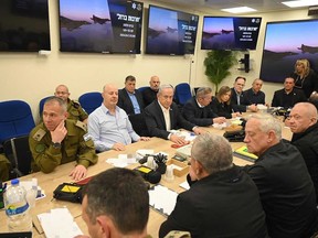 This handout picture courtesy of the Israeli Prime Minister's Office taken on April 14, 2024 shows Israel's Prime Minister Benjamin Netanyahu (centre) during a War Cabinet meeting at the Kirya in Tel Aviv. Iran's Revolutionary Guards confirmed early April 14, 2024 that a drone and missile attack was under way against Israel in retaliation for a deadly April 1 drone strike on its Damascus consulate.
