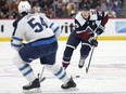 Nathan MacKinnon of the Colorado Avalanche advances the puck against the Winnipeg Jets in the second period at Ball Arena on April 13, 2024 in Denver, Colorado. (Photo by Matthew Stockman/Getty Images)
