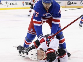 Brady Tkachuk #7 of the Ottawa Senators is checked by K'Andre Miller #79 of the New York Rangers during the third period at Madison Square Garden on Monday. The Rangers shut out the Senators 4-0.