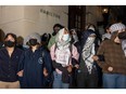 Students/demonstrators lock arms to guard potential authorities against reaching fellow protestors who barricaded themselves inside Hamilton Hall, where the office of the Dean is located, and name it after a Palestinian child allegedly killed by the Israeli military on Tuesday, April 30, 2024 in New York City.