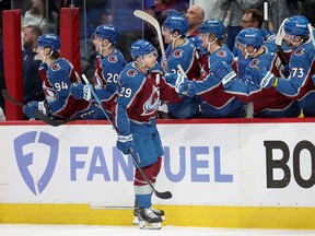 DENVER, COLORADO - APRIL 26: Nathan MacKinnon #29 of the Colorado Avalanche celebrates with his teammates after scoring against the Winnipeg Jets in the third period during Game Three of the First Round of the 2024 Stanley Cup Playoffs at Ball Arena on April 26, 2024 in Denver, Colorado. (Photo by Matthew Stockman/Getty Images)