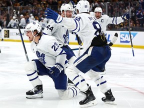 Matthew Knies, left, of the Toronto Maple Leafs celebrates after scoring the game-winning goal against the Boston Bruins to win the game 2-1 in overtime of Game 5 of the First Round of the 2024 Stanley Cup Playoffs at TD Garden on Tuesday, April 30, 2024, in Boston, Mass.