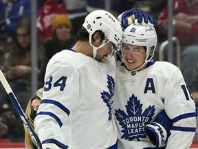 Maple Leafs' Mitch Marner (left) celebrates a goal with Auston Matthews.