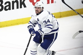 Maple Leafs' Auston Matthews celebrates his 60th goal of the season during the third period against the Buffalo Sabres, Saturday, March 30, 2024, in Buffalo, N.Y.