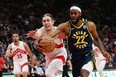 Indiana Pacers forward Isaiah Jackson and Toronto Raptors forward Kelly Olynyk battle for the ball during first half NBA basketball action in Toronto on Tuesday night. Nathan Dennette/THE CANADIAN PRESS