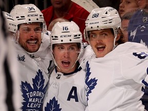 Auston Matthews, left, Mitch Marner, middle, and William Nylander in happier times, celebrating after Matthews scored the game winning goal during the third period against the New Jersey Devils at Prudential Center on March 07, 2023 in Newark, New Jersey.