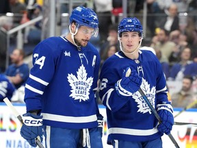 Toronto Maple Leafs' Auston Matthews, left, talks with Mitch Marner during NHL hockey action against the Vegas Golden Knights in Toronto, on Tuesday, Feb. 27, 2024.