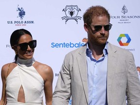 Prince Harry, right, and wife Meghan Markle, Duchess of Sussex, arrive for the 2024 Royal Salute Polo Challenge to Benefit Sentebale, Friday, April 12, 2024, in Wellington, Fla.