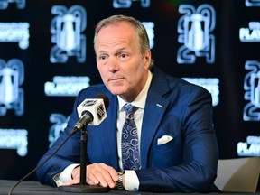 Tampa Bay Lightning head coach Jon Cooper answers questions at a news conference during the 2024 Stanley Cup Playoffs.