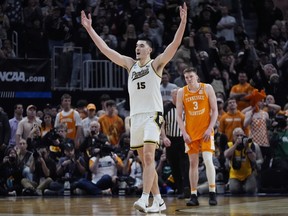 Purdue centre Zach Edey (15) reacts near Tennessee guard Dalton Knecht (3) after the team defeated Tennessee in an Elite Eight college basketball game in the NCAA Tournament, Sunday, March 31, 2024, in Detroit.