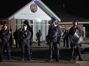 FILE - Security officers stand guard outside Orthodox Assyrian church in Sydney, Australia, April 15, 2024. Four teenagers plotted to buy guns and attack Jewish people days after a bishop was stabbed in a Sydney church, according to police documents cited in news reports on Monday, April 29, 2024.