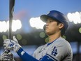 Los Angeles Dodgers designated hitter Shohei Ohtani prepares to bat during the fourth inning of the team's baseball game against the Washington Nationals at Nationals Park, Wednesday, April 24, 2024, in Washington.