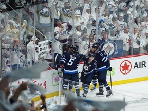 Josh Morrissey #44 of the Winnipeg Jets celebrates his first period goal on Alexandar Georgiev #40 of the Colorado Avalanche in Game One of the First Round of the 2024 Stanley Cup Playoffs at Canada Life Centre on April 21, 2024, in Winnipeg, Canada.