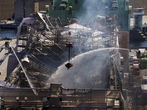 The view from the tower of Parliament as Danish firefighters and emergency personnel work after a fire ravaged the historic Boersen Stock Exchange and toppled its iconic spire in Copenhagen on April 17, 2024.