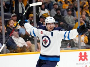 Winnipeg Jets' Mark Scheifele celebrates after scoring a goal against the Nashville Predators during the first period of an NHL hockey game Tuesday, April 9, 2024, in Nashville, Tenn.