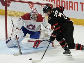 Senators captain Brady Tkachuk stickhandles the puck in front of Canadiens goaltender Cayden Primeau in the second period of Saturday's game.