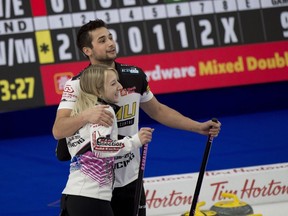 Kadriana and Colton Lott celebrate during the Canadian Mixed Double Curling Championship Calgary on Wednesday, March 24, 2021. The pair are on the verge of lcoking up a playoff spot at the world mixed doubles curling championship after posting a 10-4 win over China on Wednesday.THE CANADIAN PRESS/HO - Curling Canada, Michael Burns