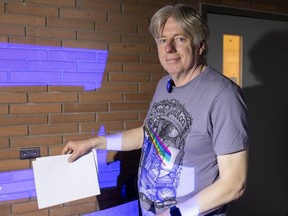 University of Calgary associate professor Jeroen Stil demonstrates a simple pinhole camera on Thursday, April 4, 2024. The DIY device could be used to safely view the upcoming solar eclipse by projecting it through a tiny pinhole, where the image is focused onto the 'screen', in this case a white piece of paper.