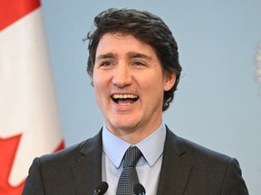 Prime Minister Justin Trudeau reacts during a joint press conference with Poland's prime minister in Warsaw on Feb. 26, 2024.