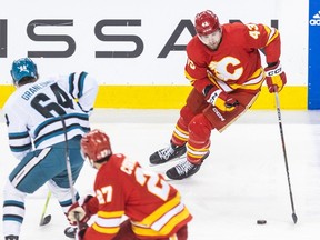 Calgary Flames forward Adam Klapka hits the neutral zone against the San Jose Sharks at the Scotiabank Saddledome in Calgary on Thursday, April 18, 2024.