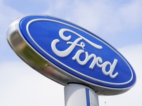 FILE - A Ford sign is shown at a dealership in Springfield, Pa., Tuesday, April 26, 2022. Ford is recalling nearly 43,000 small SUVs, Wednesday, April 10, 2024, because gasoline can leak from the fuel injectors onto hot engine surfaces, increasing the risk of fires. But the recall remedy does not include repairing the fuel leaks.