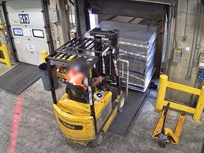 A suspected Toronto Pearson employee is seen loading millions of dollars in gold onto at the airport on April 17, 2024.