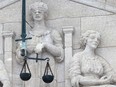 A Lady Justice statue on the law courts building in Winnipeg is pictured in a file photo.