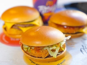 The Sweet Chili Junior Chicken, (clockwise from centre) the Surf 'N Turf Burger and the Chicken Cheeseburger from McDonalds Canada's new remix menu are photographed In Toronto, on Thursday, March 28, 2024.