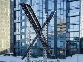 An "X" sign sits atop the social media platform's headquarters, in San Francisco, on July 28, 2023.