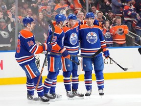 Edmonton Oilers Connor McDavid (97) celebrates his goal with teammates against the Colorado Avalanche during first period NHL action on Friday, April 5, 2024 in Edmonton.