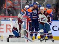 Edmonton Oilers Mattias Ekholm (14) celebrates his goal with teammates against the Colorado Avalanche goalie Alexandar Georgiev (40) during second period NHL action on Friday, April 5, 2024 in Edmonton.