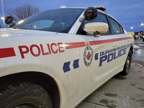 A Durham Regional Police car is shown at a Bowmanville, Ont. shopping centre parking lot on Tuesday Feb. 28, 2023.