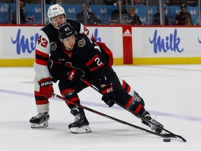 Senators forward Parker Kelly tries to get past the Devils' Luke Hughes during first-period action.