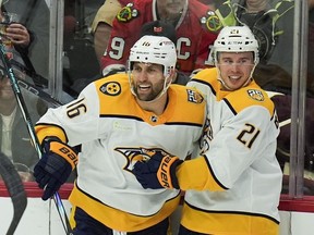 Nashville Predators left wing Jason Zucker, left, and left wing Anthony Beauvillier celebrate Zuckers goal against the Chicago Blackhawks during the second period of an NHL hockey game Friday, April 12, 2024, in Chicago.