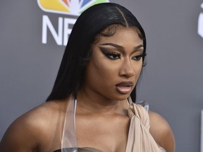 FILE - Megan Thee Stallion arrives at the Billboard Music Awards at the MGM Grand Garden Arena, May 15, 2022, in Las Vegas. A photographer who worked for the hip-hop star said in a lawsuit filed Tuesday, April 23, 2024, that he was forced to watch her have sex, was unfairly fired soon after and was abused as her employee.