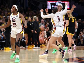 Raven Johnson #25 of the South Carolina Gamecocks celebrates after beating the Iowa Hawkeyes in the 2024 NCAA Women's Basketball Tournament National Championship at Rocket Mortgage FieldHouse on in Cleveland on Sunday. South Carolina 87-75.