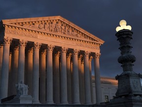 FILE - The Supreme Court is seen at sunset in Washington, on Jan. 24, 2019. On the left and right, Supreme Court justices seem to agree on a basic truth about the American system of government: No one is above the law, not even the president.