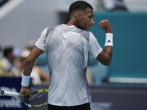 Felix Auger-Aliassime, of Canada, celebrates winning a game over Adam Walton, of Australia, in their men's first round match at the Miami Open tennis tournament, Thursday, March 21, 2024, in Miami Gardens, Fla. Auger-Aliassime beat Luca Nardi of Italy 6-2, 6-3 in the first round of the Monte Carlo Masters on Monday, setting up a match against world No. 3 Carlos Alcaraz.