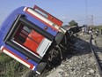 FILE - An overturned train car is seen near a village at Tekirdag province, Turkey on July 8, 2018. A court in Turkey sentenced nine rail officials to more than 108 years' imprisonment over a train crash six years ago that killed 25 people, local media reported on Thursday, April 25, 2024. A passenger train operated by Turkish State Railways, or TCDD, derailed in July 2018 as it passed through Corlu district some 110 kilometers (68 miles) west of Istanbul.