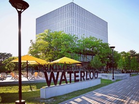 University of Waterloo sign outside school building.