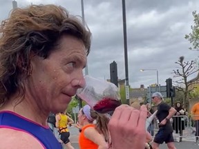Tom Gilbey samples some wine during the London Marathon.