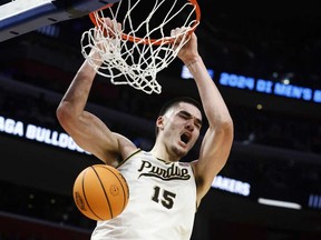 Purdue centre Zach Edey dunks during the first half of a Sweet 16 college basketball game against Gonzaga in the NCAA Tournament, Friday, March 29, 2024, in Detroit.