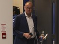 The Toronto Maple Leafs GM Brad Treliving enters the end of year press conference.