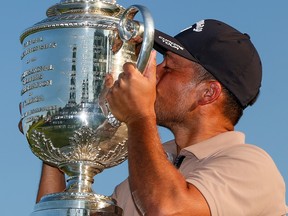Xander Schauffele kisses the Wanamaker Trophy after winning the 2024 PGA Championship at Valhalla Golf Club.